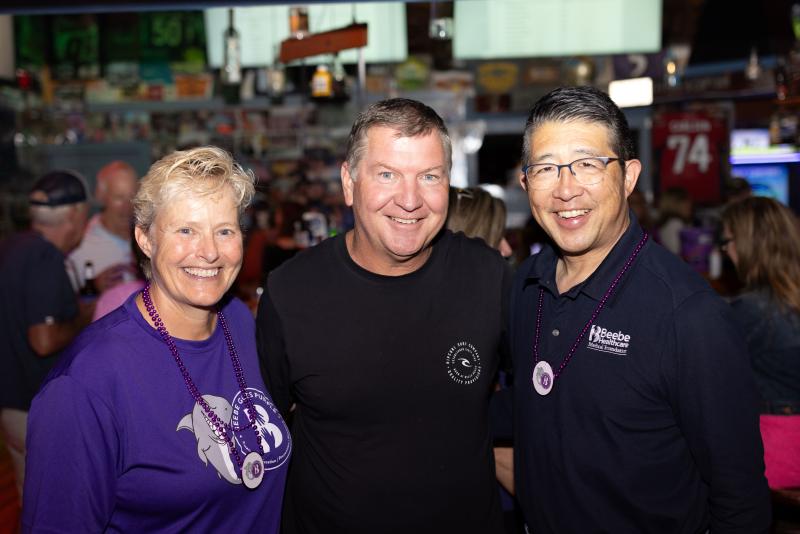 Pausing for a photo during the fundraiser are (l-r) Kay Young, Beebe Medical Foundation executive director of development; Steve “Monty” Montgomery, The Starboard owner; and Dr. David Tam, Beebe Healthcare president and CEO.